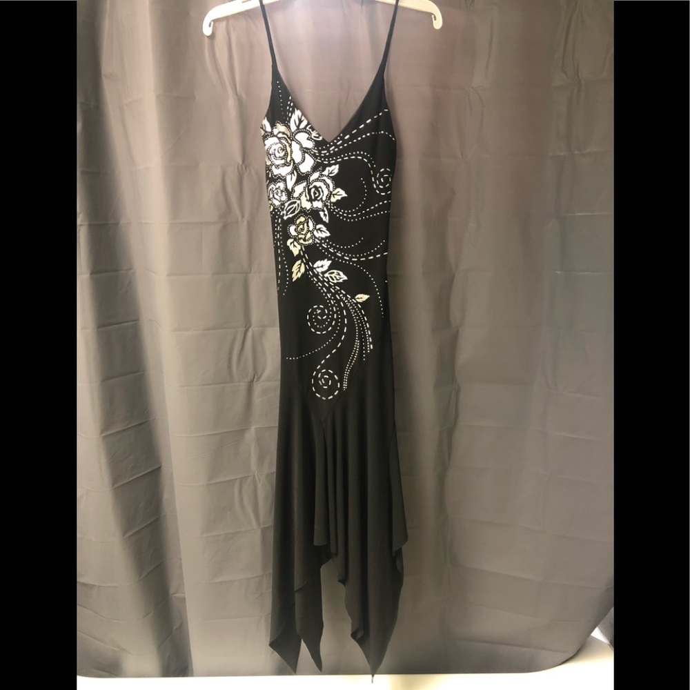 Black with silver appliqué on the front asymmetrical dress. NWOT
